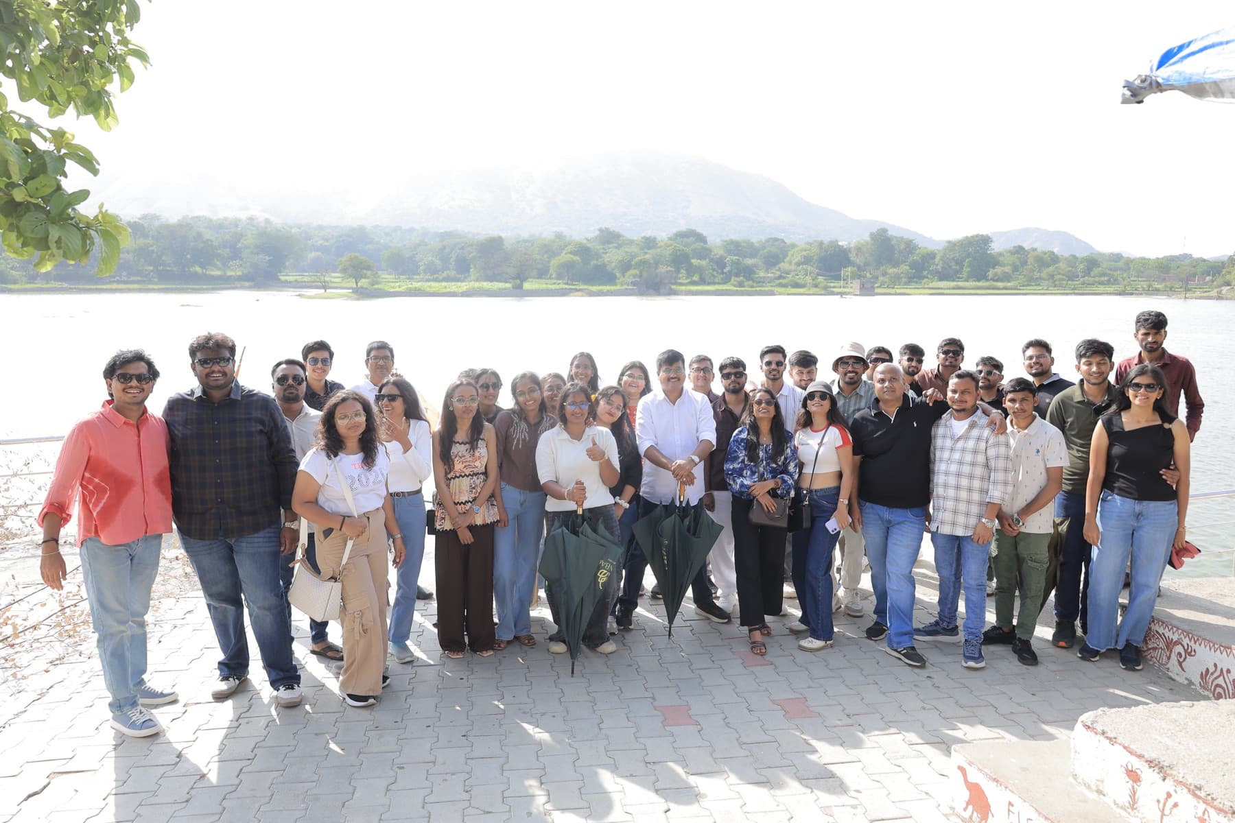 The MedReg team by a lake during a team trip