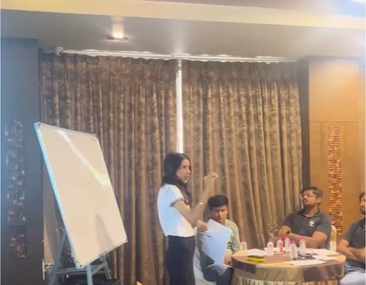 Ms. Kajol Yadav explaining a concept at the whiteboard