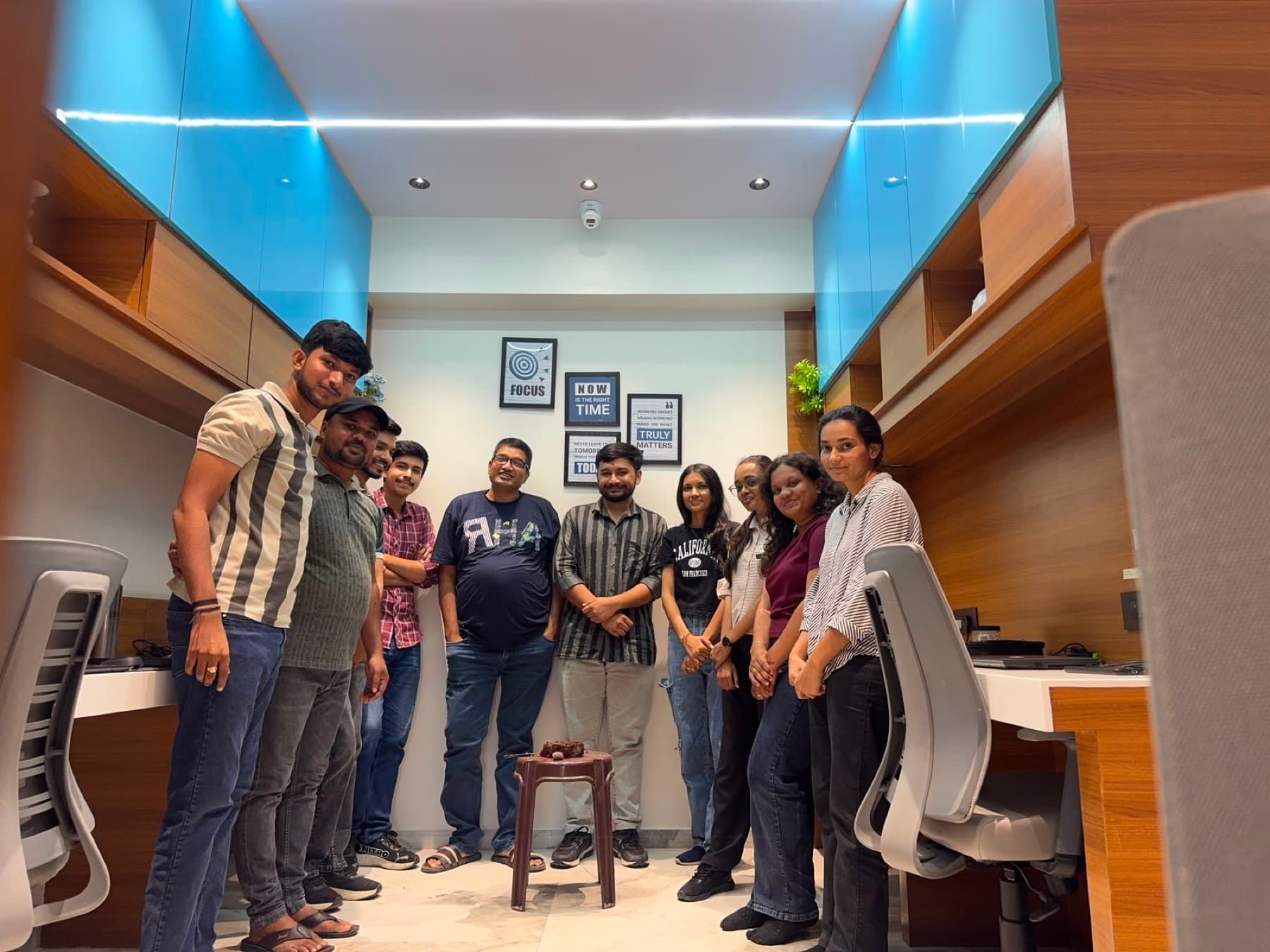 MedReg team members at a birthday celebration in the office